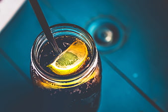 Top View of Cola Soda with Lemon Slice in Glass Jar