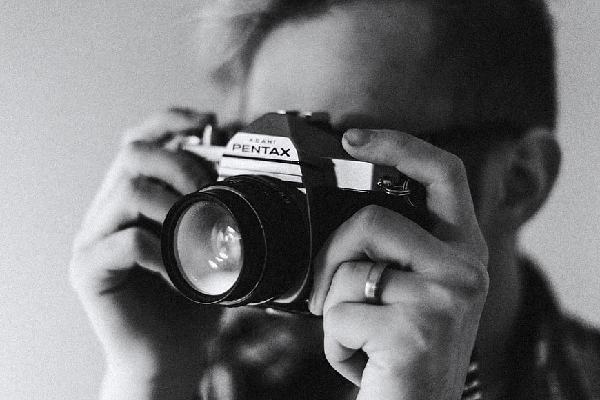 Man Holding Vintage Pentax Camera Close Up