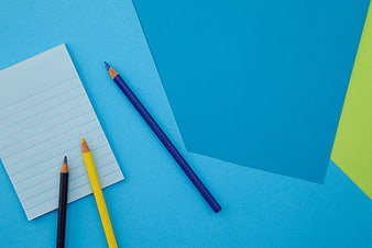Colorful Stationery Flat Lay with Blue Background and Copyspace