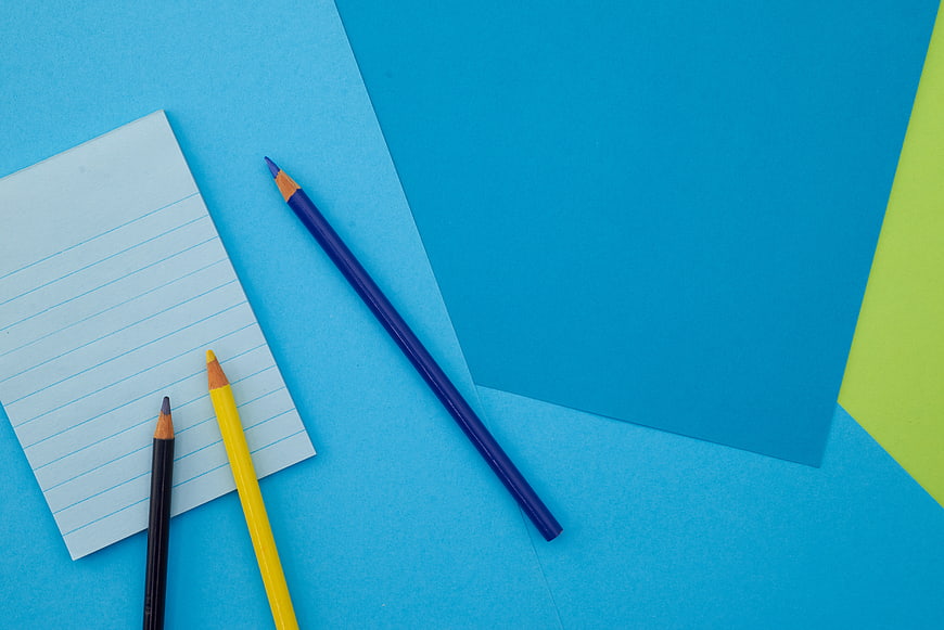 Colorful Stationery Flat Lay with Blue Background and Copyspace