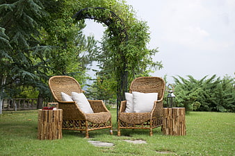 Cozy Wicker Armchairs in Lush Garden Setting