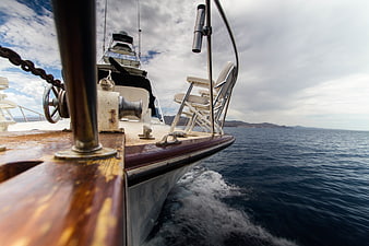 Side view of luxury yacht sailing on blue ocean