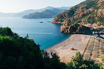 Aerial View of Coastal Village and Beach in Corsica