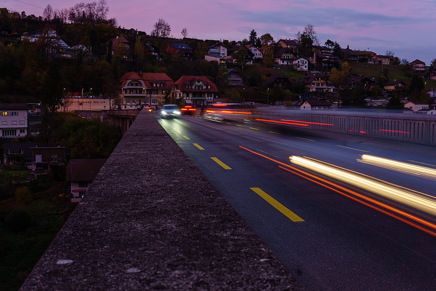 Long exposure light trails on bridge at dusk