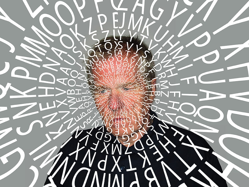 Man with swirling letters representing memory loss and dementia