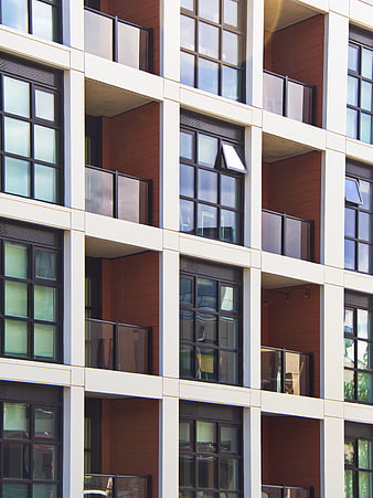 Modern Apartment Building Facade with Balconies and Windows