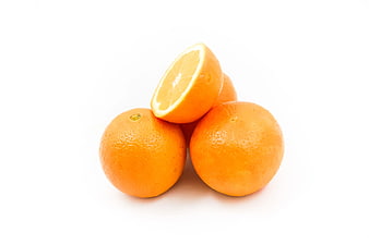Fresh Oranges on White Background with One Cut in Half
