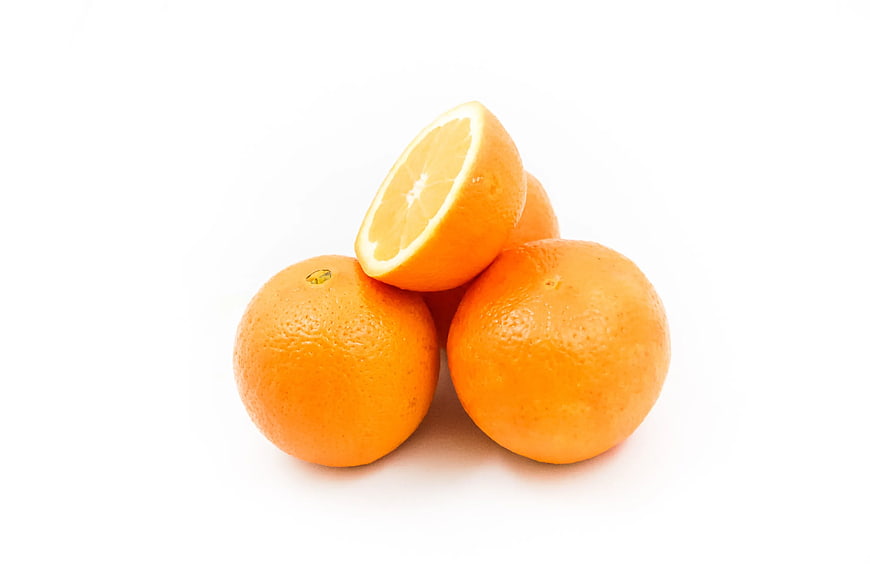 Fresh Oranges on White Background with One Cut in Half