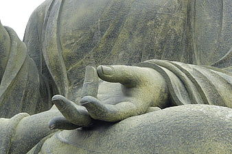 Close-up of Stone Buddha Hand in Meditation Mudra