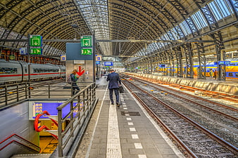 Businessman walking on platform at Amsterdam Central Station