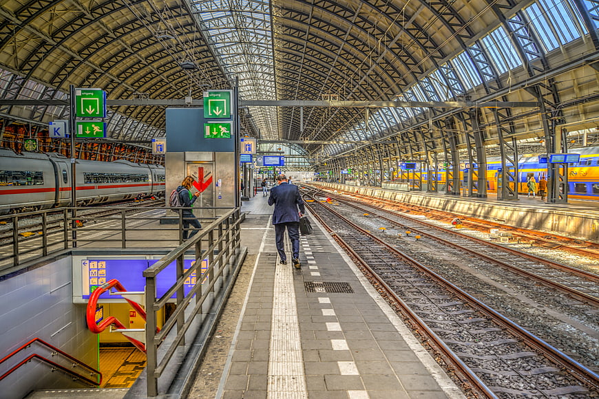 Businessman walking on platform at Amsterdam Central Station
