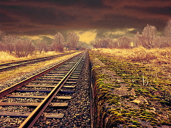Dramatic Railway Tracks Leading Through Rural Landscape
