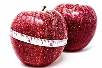 Red Apples With Measuring Tape On White Background