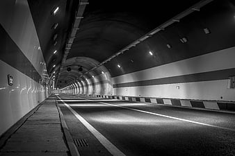 Black and white empty highway tunnel with perspective lines