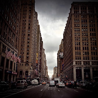 Dramatic Urban Street View with Tall Buildings and Traffic