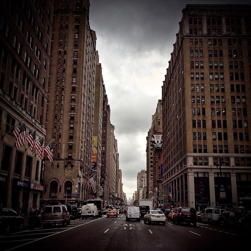 Dramatic Urban Street View with Tall Buildings and Traffic