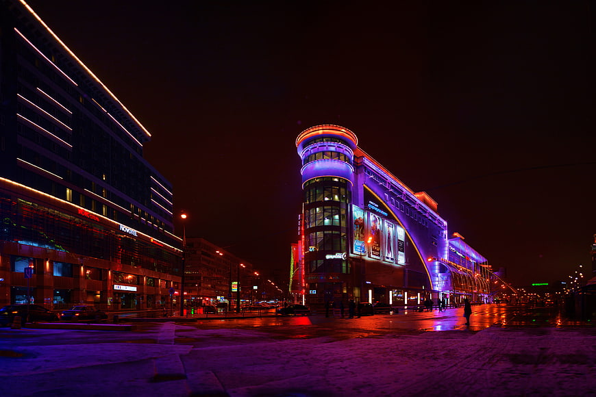 Vibrant Moscow Cityscape at Night with Neon Lights and Snow