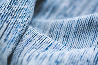 Close-up of blue and white striped knitted fabric texture