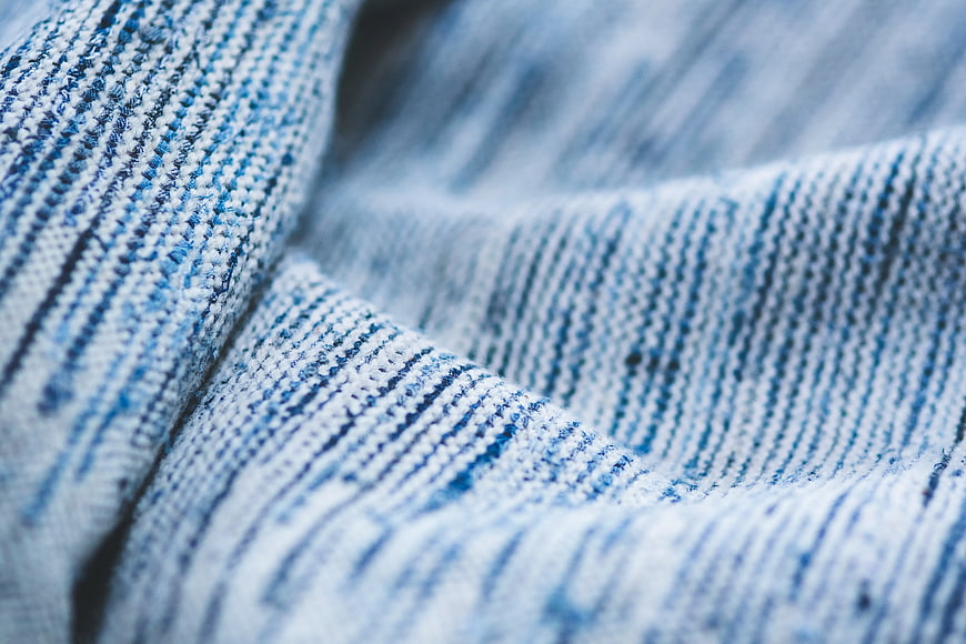 Close-up of blue and white striped knitted fabric texture