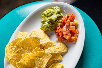 Tortilla Chips with Guacamole and Salsa on White Plate