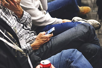 Close-up of person using smartphone at conference