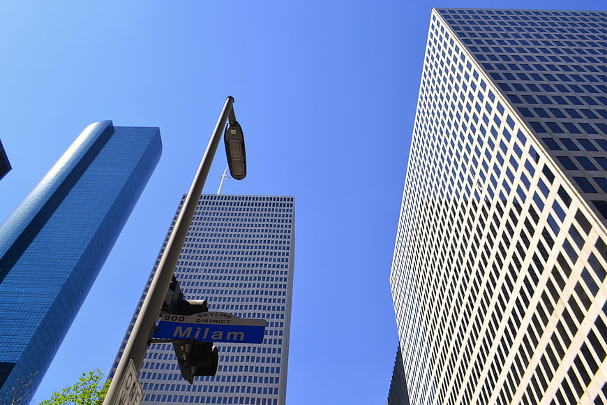 Milam Avenue Street Sign and Skyscrapers in Houston Business District