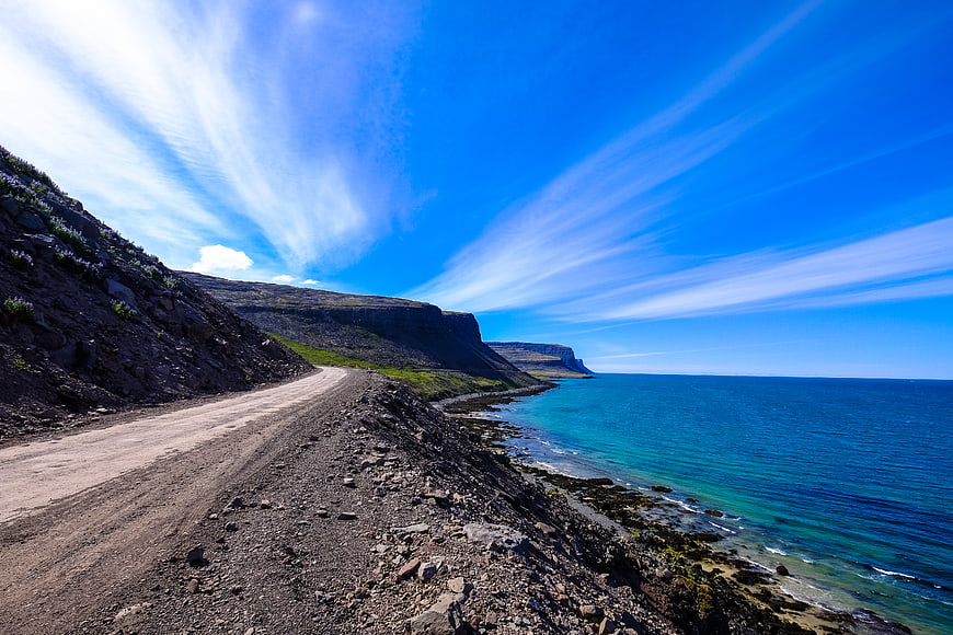 Scenic Coastal Road Along Dramatic Cliffs and Blue Ocean