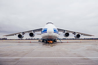 Front view of large cargo airplane on airport tarmac