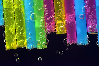 Colorful Plastic Straws With Bubbles On Black Background