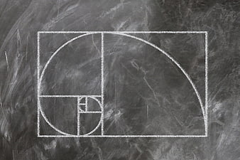 Golden Ratio Fibonacci Spiral Chalk Drawing on Dark Blackboard