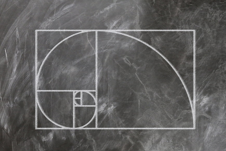 Golden Ratio Fibonacci Spiral Chalk Drawing on Dark Blackboard