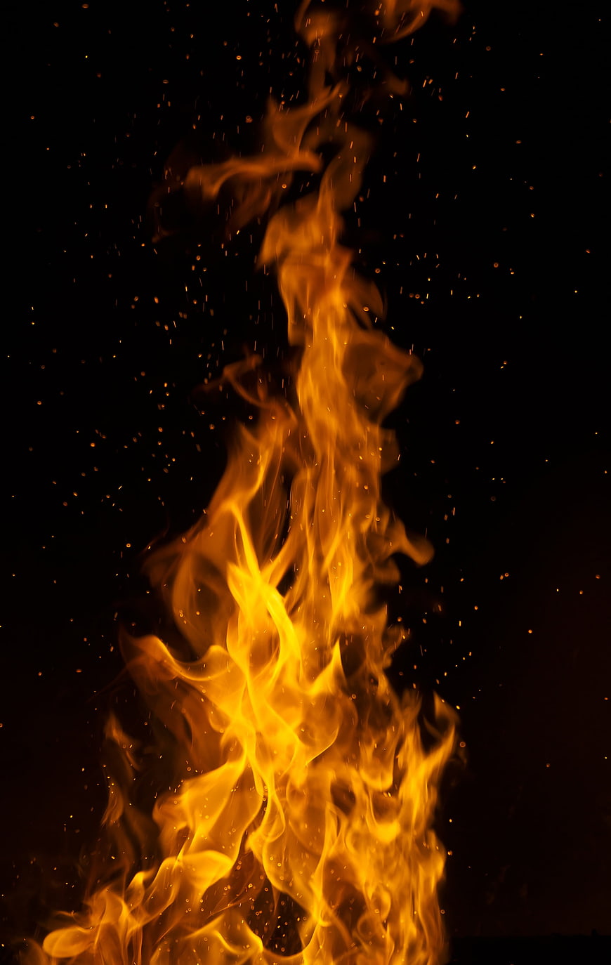 Intense Orange Flames Rising Against Black Background
