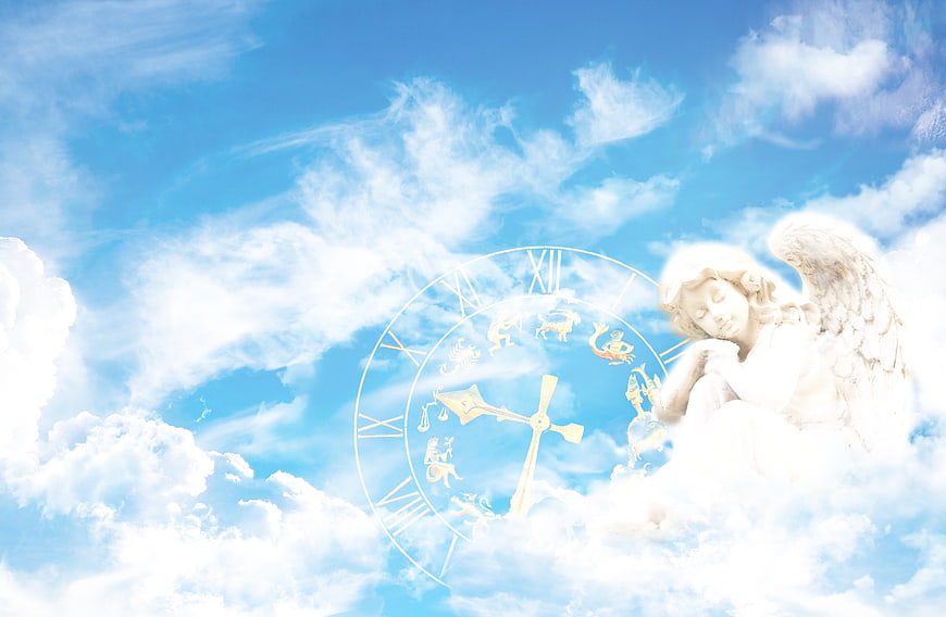 Sleeping angel statue with zodiac clock in blue sky clouds