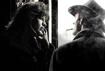 Cinematic Black and White Couple Smoking by Window