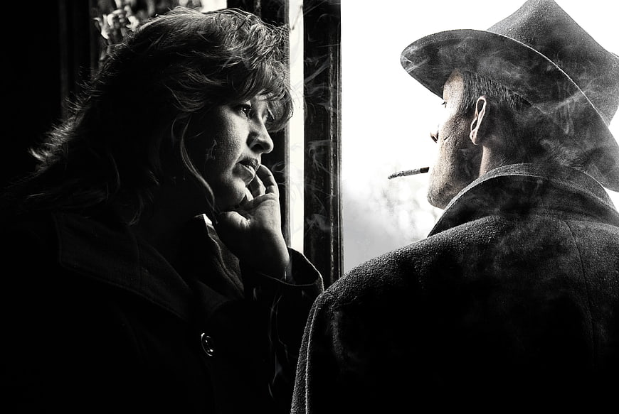 Cinematic Black and White Couple Smoking by Window