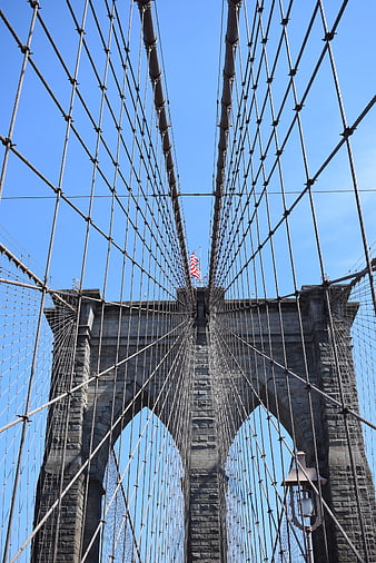 Low angle view of Brooklyn Bridge cables and tower