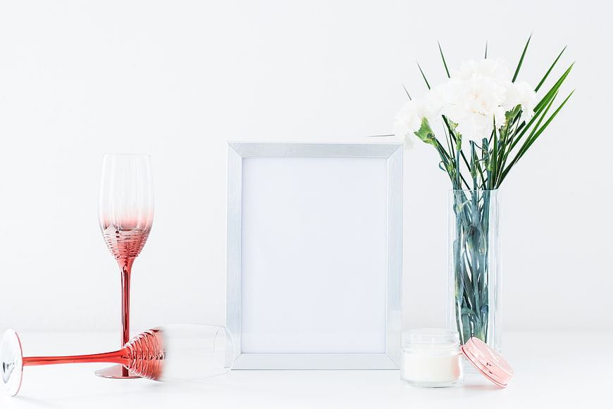 Minimalist White Photo Frame Mockup with Pink Glasses and Flowers