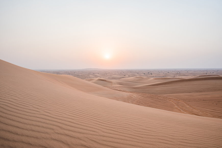 Sunset Over Vast Sand Dunes in the Desert