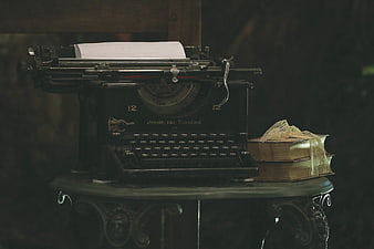 Vintage Remington Typewriter and Old Books on Decorative Table
