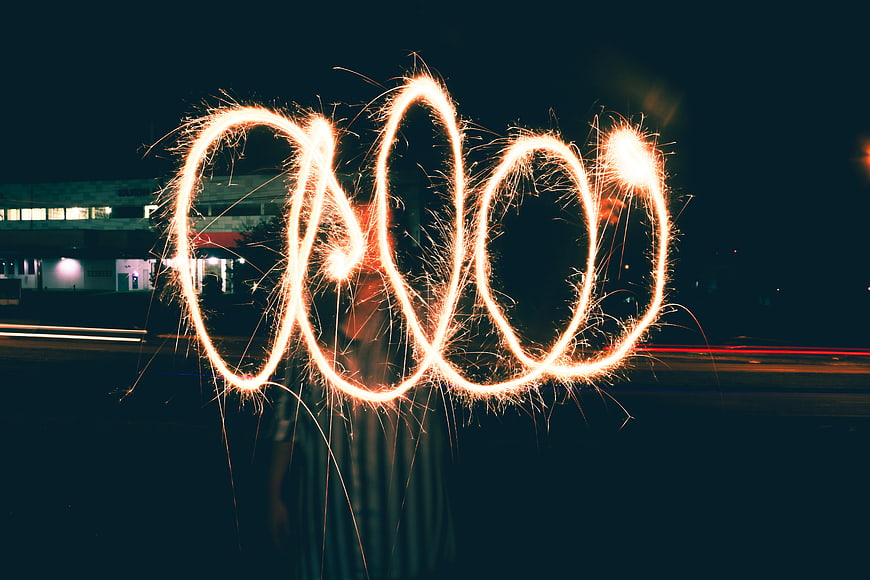 Sparkler light painting infinity symbol at night