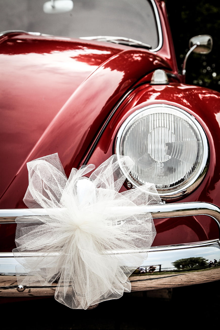 Red Vintage Car Front With White Wedding Tulle Bow
