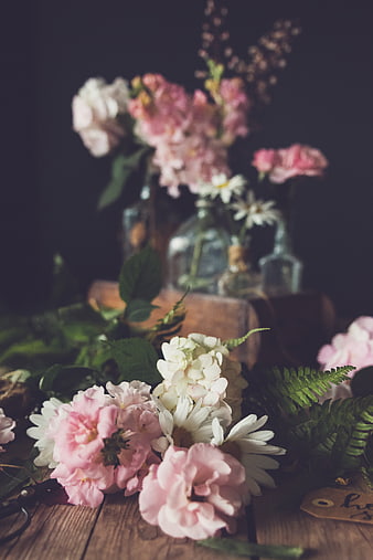 Rustic Pink and White Floral Arrangement on Wooden Table