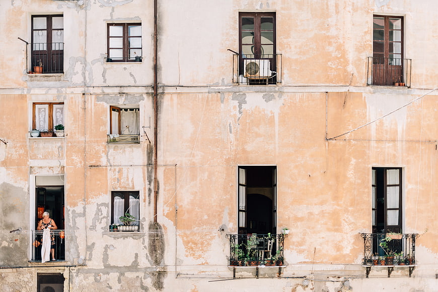 Weathered Peach Apartment Building Facade with Balconies