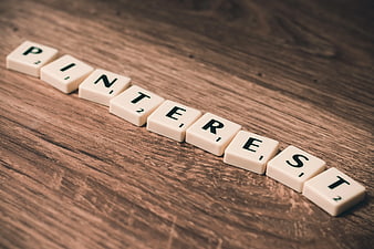 Scrabble Tiles Spelling Pinterest on Wooden Background