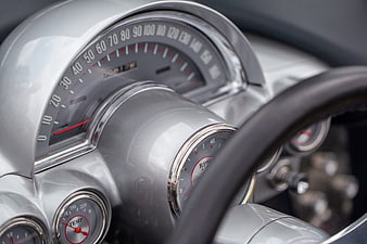 Close-up of vintage car dashboard with speedometer and gauges