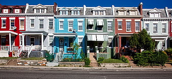 Colorful row houses on a sunny city street