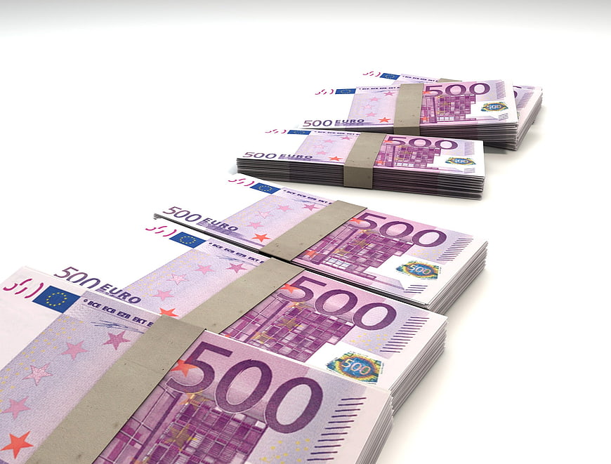 Stacks of 500 Euro Banknotes on White Background