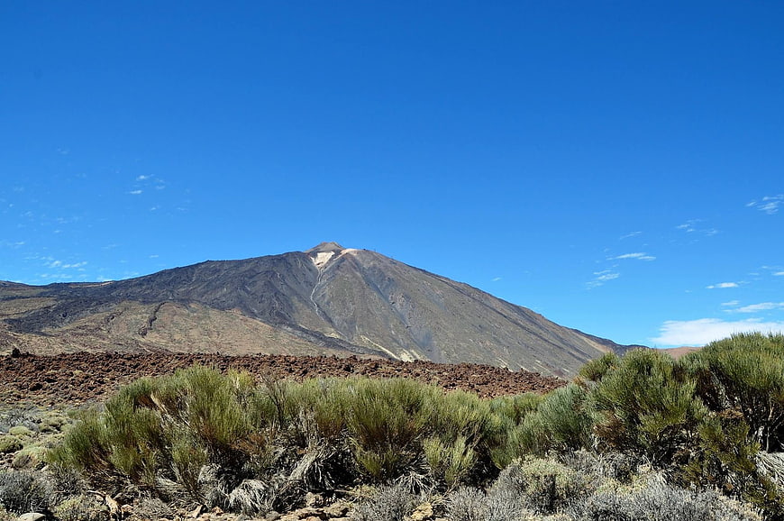 Volcanic Mountain Landscape with Blue Sky and Desert Vegetation