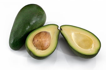 Fresh Whole and Halved Avocado on White Background