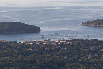 Aerial View of Coastal Town with Boats in Harbor